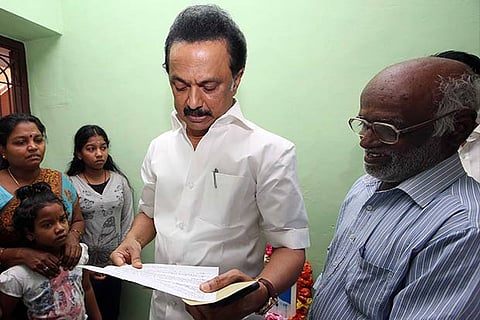 DMK working president MK Stalin going through a petition at Kolathur