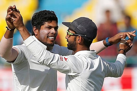 Umesh Yadav exults after taking an Australian wicket