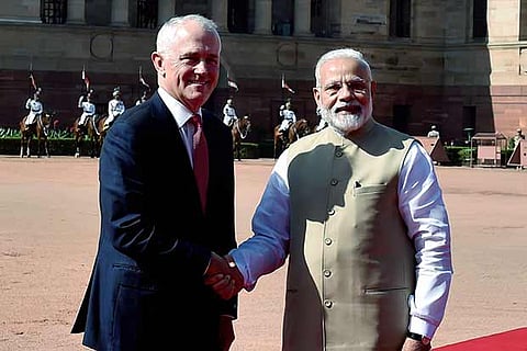 Prime Minister Narendra Modi shakes hand with his Australian counterpart Malcolm Turnbull
