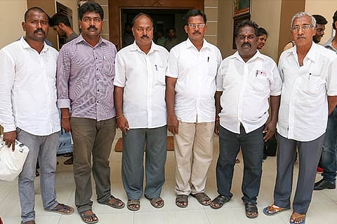 A group of fishermen at a press meet in the city