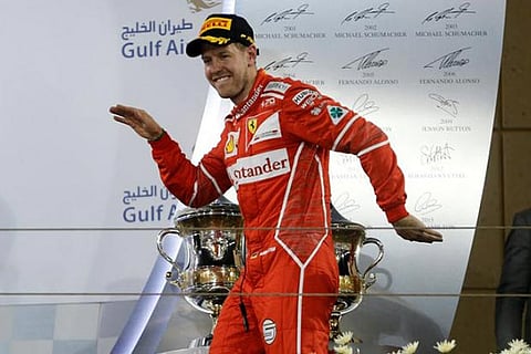 Ferrari Formula One driver Sebastian Vettel of Germany celebrates after winning Bahrain GP