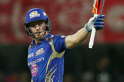 Jos Buttler raises his bat after reaching fifty during match IPL match against Kings X1 Punjab