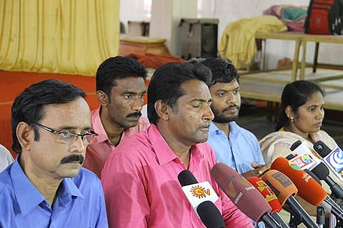 Mugilan (second from left) addressing the media along with other activists