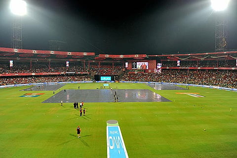 Pitch been covered by sheets as it rains during the IPL match between RCB and SRH in Bengaluru