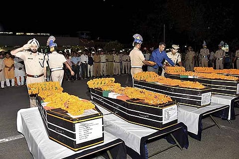 File photo of CRPF officers paying their tributes to slain jawans at Patna airport
