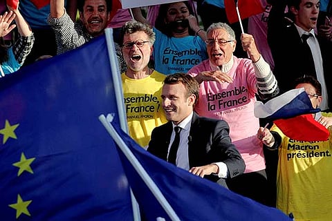 Emmanuel Macron arrives for a campaign rally in Albi, southern France
