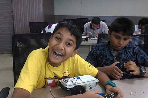Young students at a robotics workshop