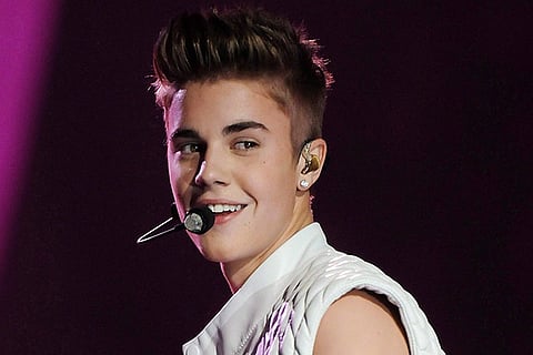 Bieber's day out: Enjoys coffee, greets fans from his car