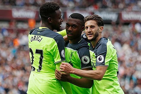 Liverpool players celebrate their win against West Ham