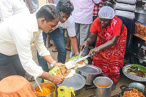 Sundari Akka serves food to a customer on Friday