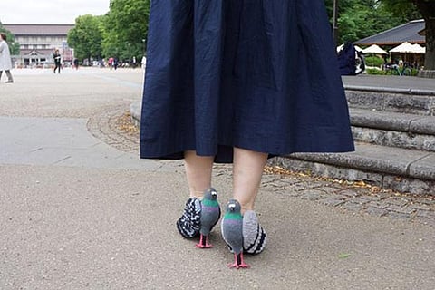Japanese woman walking in pigeon shoes goes viral on social media