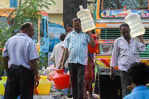 Residents fetch water from a tanker in Chennai