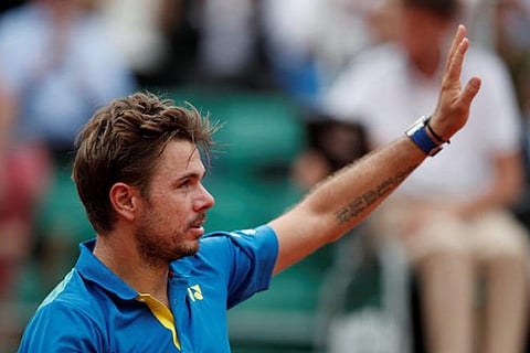 Stan Wawrinka celebrates after winning his first round match against Jozef Kovalik