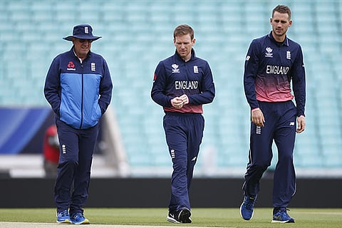 England captain Eoin Morgan (centre) with head coach Trevor Bayliss (left) before net session