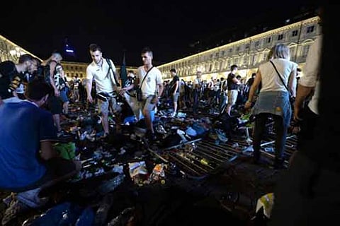 panic movement in the fanzone where thousands of Juventus fan in Turin.(AFP)