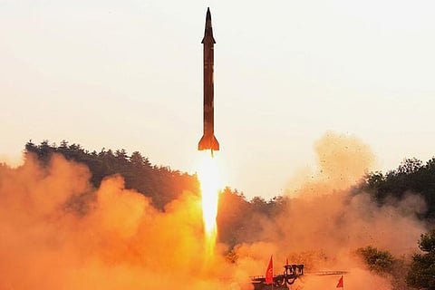 A ballistic rocket is test-fired through a precision control guidance system