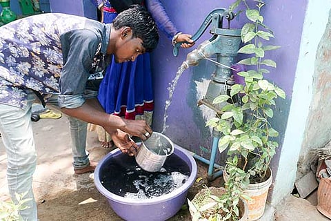 Water mixed with sewage flowing from a handpump at Ice House in the city