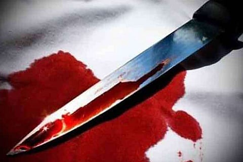 Image of a knife with bloodstains used for representational purposes only