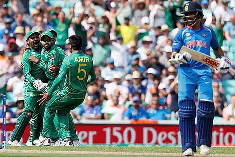 Pakistan players celebrate the wicket of Shikhar Dhawan, during the ICC Champions Trophy finals