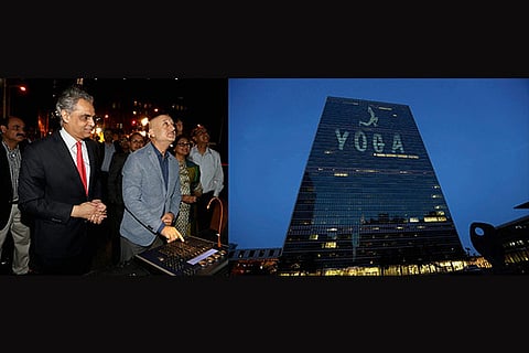 Anupam and Syed pressing the button to light up the UN building