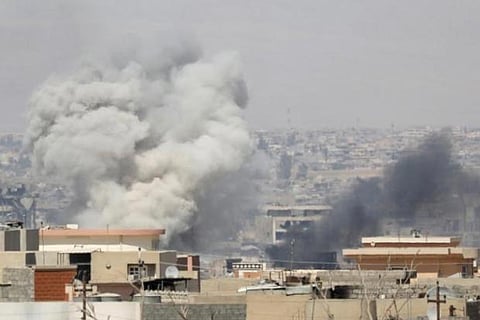 Smoke billows after an air strike by Iraqi forces towards the positions of the IS militants