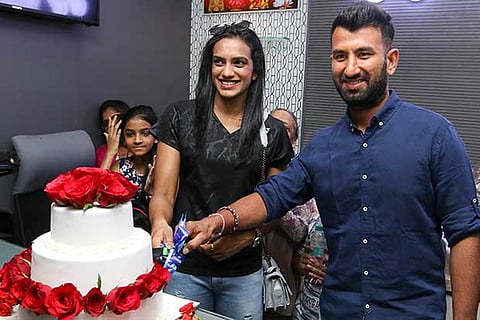 Badminton ace P V Sindhu (left) and cricketer Cheteshwar Pujara at a promotional event