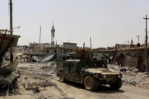 Iraqi Federal Police in a military vehicle during fighting between Iraqi forces and IS militants