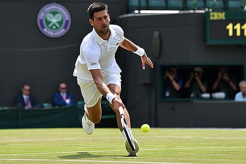 Serbia?s Novak Djokovic returns to Czech Republic?s Adam Pavlasek