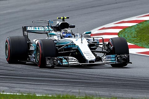 Bottas beats Vettel to take pole in Austria