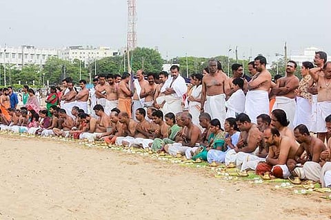 People offering ?tharpanam? on the Marina Beach in Chennai