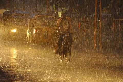 A cyclist braves the rain