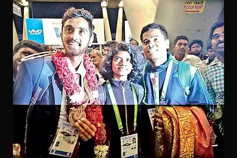 Prithvi Sekhar(L), Jerlin Anika and others at the airport