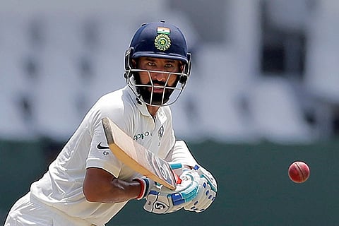 India's Cheteshwar Pujara plays a shot