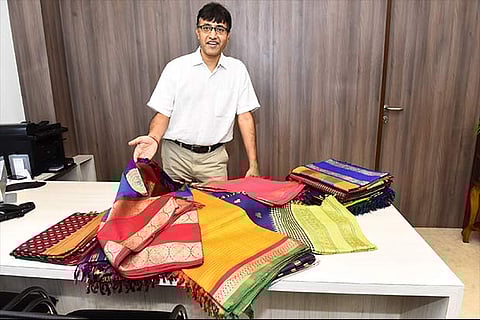 Santosh Parekh with sarees to be presented at the exhibition