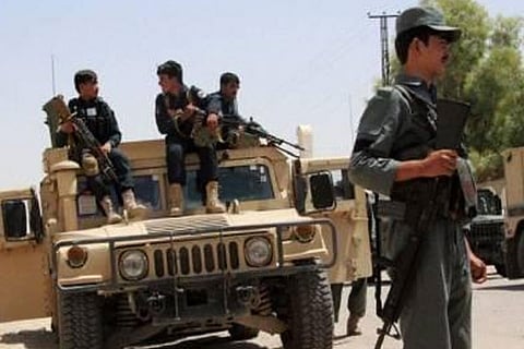File photo shows Afghan security personnel amid a battle with Taliban militants