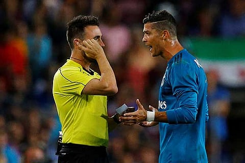 Ronaldo speaks with referee Ricardo de Burgos Bengoetxea after being shown a red card