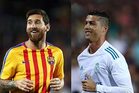 Lionel Messi (L) and Cristiano Ronaldo