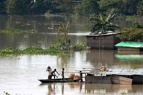 Villagers leaving Morigaon, Assam after the floods.(Photo: PTI)