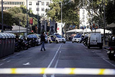 Police at the scene after a van crashed into a crowd in Barcelona, Spain