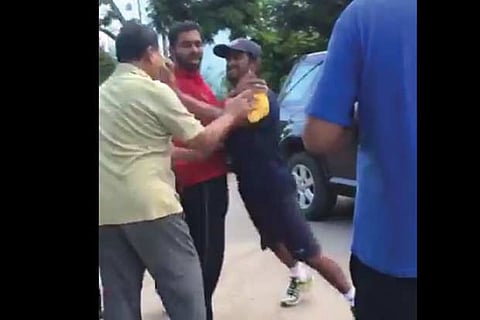 Ambati Rayudu (wearing cap)