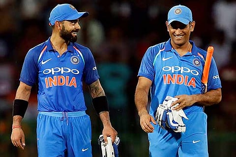 Captain Kohli and teammate MS Dhoni celebrate after winning the match and series against Sri Lanka