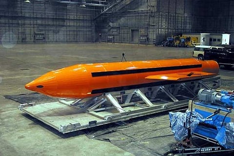 A Massive Ordnance Air Blast (MOAB) weapon is prepared for testing at an Air Force Center in USA
