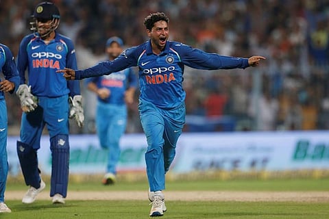 India's bowler Kuldeep Yadav celebrates his hat trick against Australia during 2nd ODI cricket match