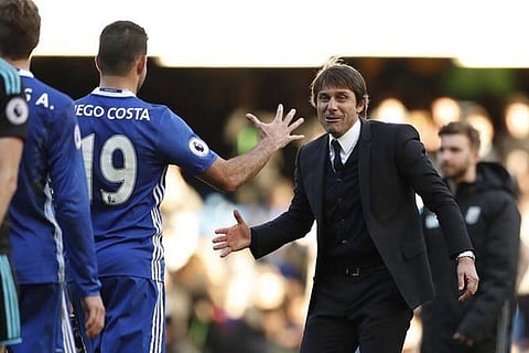 Chelsea manager Antonio Conte celebrates with Diego Costa