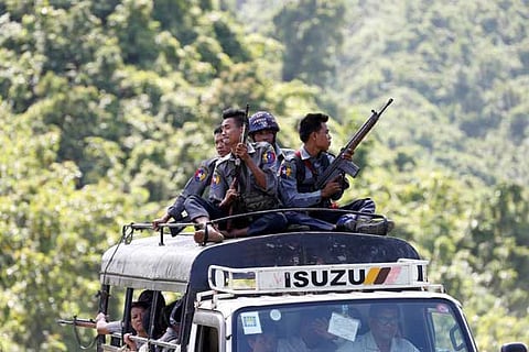 Police guard UN convoy carrying staff as they flee from Arakan Rohingya Salvation Army (ARSA)