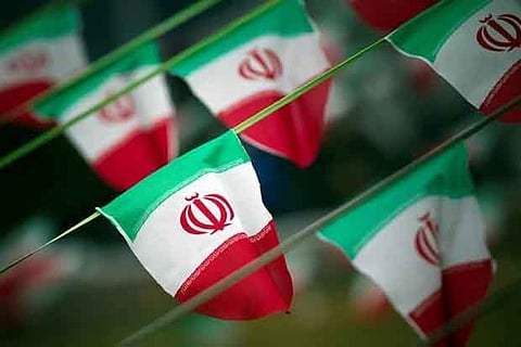 Iran's national flags are seen on a square in Tehran