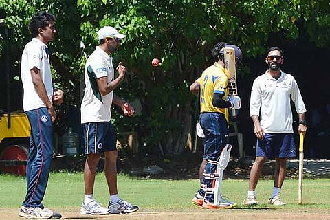 Indian off spinner R Ashwin (second from left) and Dinesh Karthik (R) during the practise session