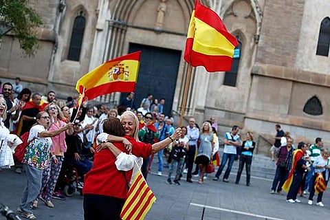 A group of pro-union supporters demonstrate in a square in Sabadell, Calatonia, Spain