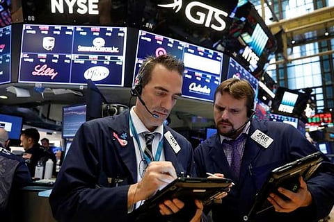Traders work on the floor of the New York Stock Exchange (NYSE) in New York, US