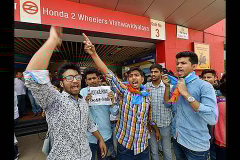 NSUI activists protesting in New Delhi on Monday against the proposed fare hike of Metro trains